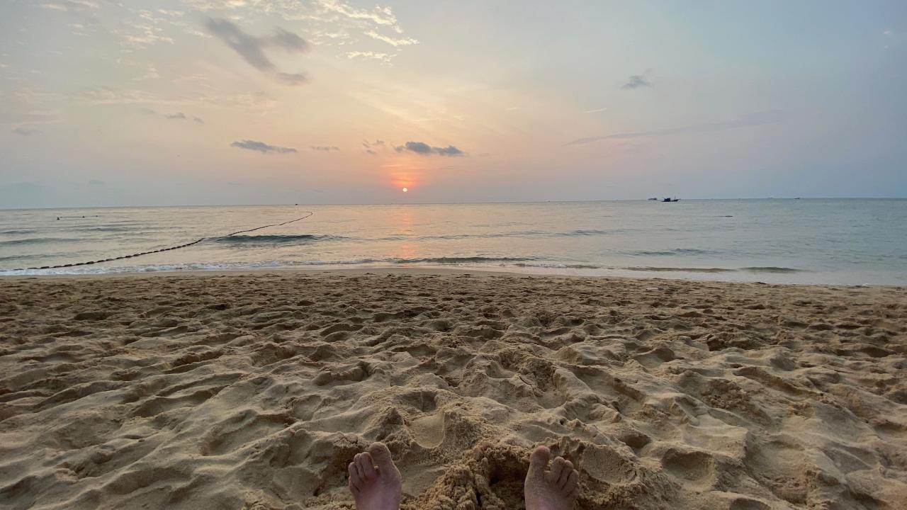 Ben's feet on a beach in Crete