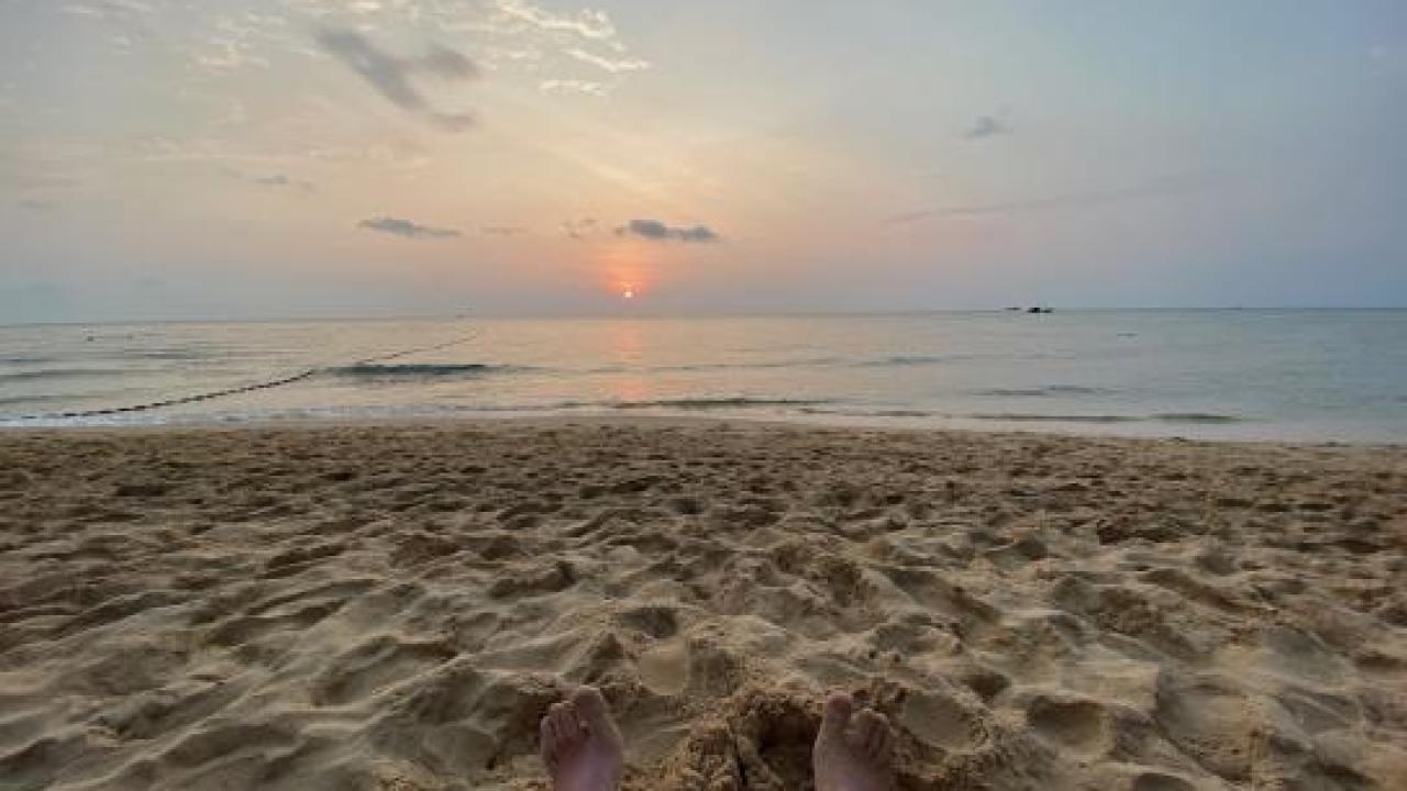Ben's feet on a beach on Crete
