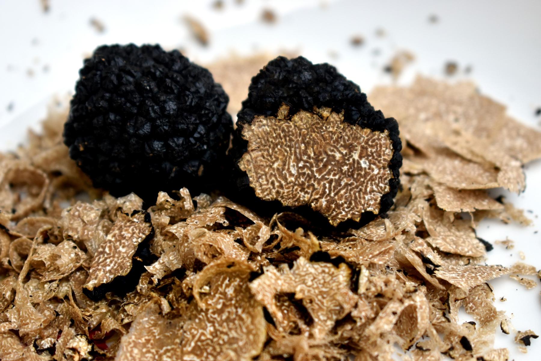 Whole and cut truffles close up photo